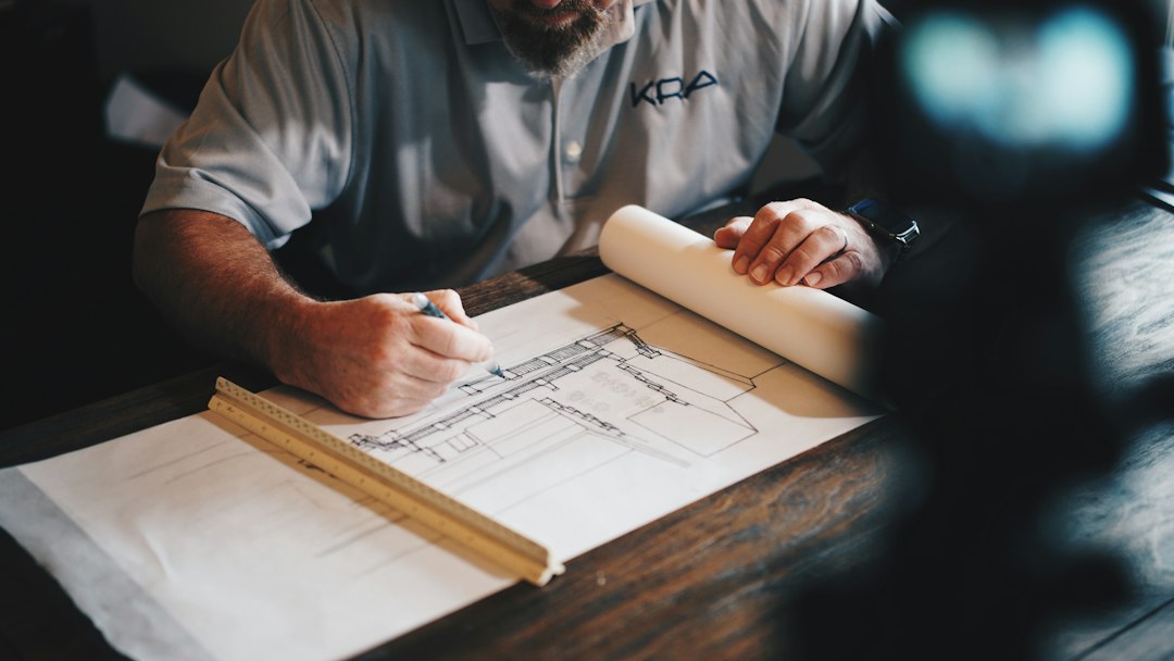 Architectural plans and construction work representing project scope decisions